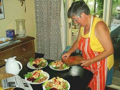 Yvonne serves lunch for four.