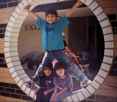 Here I am at the zoo with my sister Jennifer and her friend Ashley. I'm eight or nine.