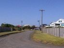 holiday houses--and precarious-looking electricity poles [13393 bytes]